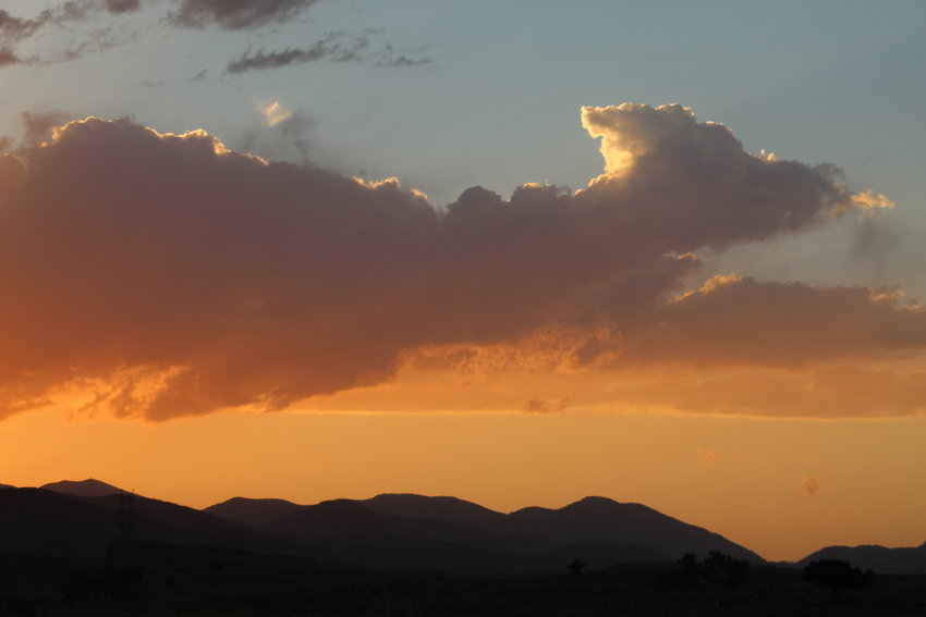 An animal-shaped cloud forms over north Golden during sunset on June 16.